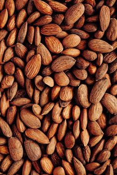 almonds and pistachio nuts are shown in this image