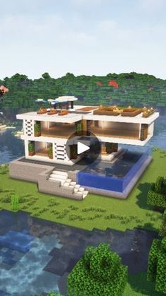 a house in the middle of a lake surrounded by trees and bushes, with a video demonstrating how to build it