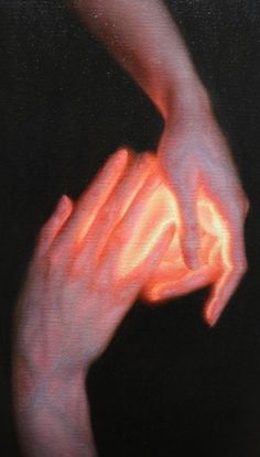 two hands reaching towards each other in the dark