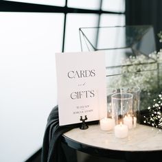 a table with candles and cards on it