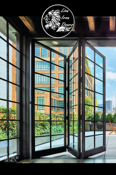 an open glass door leading to the outside with cityscape in the back ground