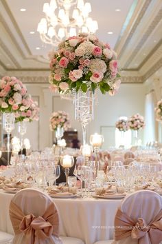 the tables are decorated with pink and white flowers