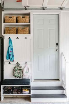 the entryway is clean and ready to be used as a storage area for shoes