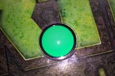 a green object sitting on top of a floor