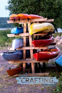 a wooden rack with kayaks and canoes on it