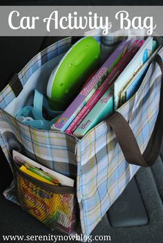 the car activity bag is filled with books, pens, and other things in it