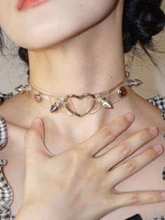 Embrace your Y2K millennial vibes with this edgy yet adorable punk studs heart choker. This choker features a leather subculture design, perfect for adding a touch of punk attitude to your outfit.   Please note that this product includes only the choker. Edgy Choker For Alternative Fashion, Trendy Silver Choker For Concert, Trendy Silver Choker For Alternative Fashion, Trendy Adjustable Choker For Valentine's Day, Trendy Choker For Concerts, Trendy Choker For Concert, Trendy Choker For Valentine's Day Party, Trendy Party Choker For Valentine's Day, Trendy Valentine's Day Party Choker