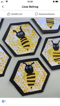 four bee coasters made out of paper and glue on a table with yellow honeycombs