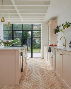 a kitchen with an open door leading to the outside