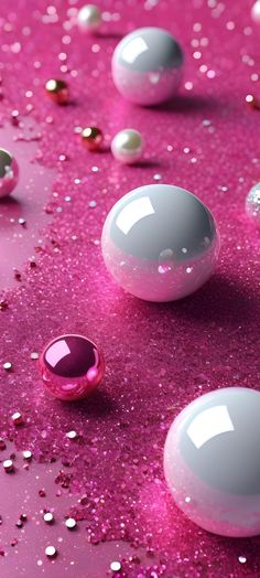 pink and white bubbles are floating in the air on a purple surface with silver flecks