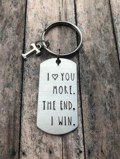 i love you more than the end, i win keychain on wooden planks