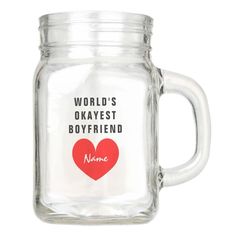 a glass jar with a red heart on the lid and words written in black ink