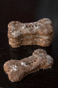 two brown dog treats sitting on top of a table