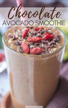 chocolate avocado smoothie in a glass with straw