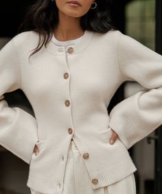 Cooper Cardigan Warm Ivory Featuring a structured hourglass silhouette and a very slight bell sleeve, this chic knit is unlike anything we’ve done before. Ultra-soft wool cashmere and a classic shape are easily styled with everything from wide-leg trousers to your favorite skirt. 70% wool, 30% cashmere. Made in China. Fitted button-down cardigan. | 70% wool, 30% cashmere. Made in China of Peruvian yarn. Fitted button-down cardigan. Dry clean. Fits true to size. | Jenni Kayne Women's Cooper Cardi Structured Cardigan, Sweaters Style, Clean Fits, Clothing Wishlist, Winter Knitwear, The Cardigans, Hourglass Silhouette, Slim Sweater, Casual Chique