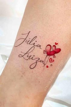 a woman's foot with a tattoo that says julia, love and hearts on it