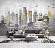 a living room with a couch, chair and ottoman in front of a cityscape wall mural