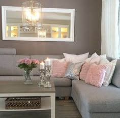 a living room filled with furniture and a chandelier