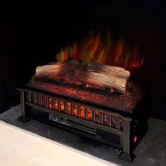 a fire burning inside of a fireplace in a room