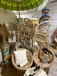 wicker baskets and umbrellas are on display in a room with wood flooring