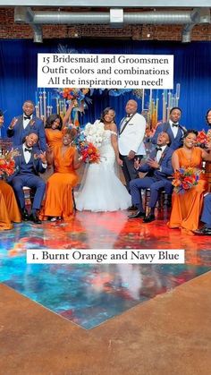 the bride and groom are posing with their bridal party in front of an orange and navy blue backdrop