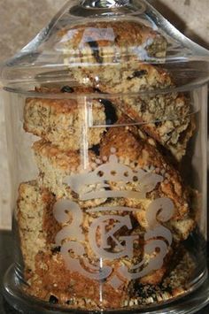 a glass jar filled with cookies on top of a counter