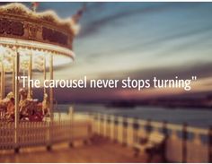 a carousel with the caption'the carousel never stops turning '