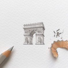 a pencil drawing of the arc de trioe in paris, with an eraser next to it