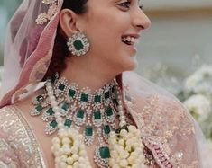 a woman in a bridal gown and jewelry