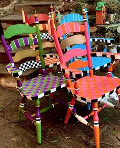 colorful chairs are stacked on top of each other