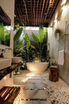 a bath room with a tub a sink and a plant on the wall next to it