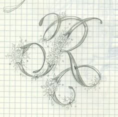 a drawing of the letter r with flowers and leaves in it on a sheet of graph paper