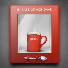 a red coffee mug sitting in front of a mirror with the words in case of monday's on it