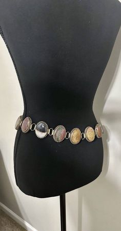 This vintage boho belt is perfect for any fashion-forward woman who wants to make a statement. The belt features smooth stones in the Southwestern Navajo style, adding a touch of ancient culture to your outfit. The boho style of the belt makes it perfect for casual wear or even dressing up for a night out. The belt is made of high-quality materials and is sure to last for years to come. It is perfect for any woman who wants to add a touch of elegance to her wardrobe. The stone accents are sure to catch the eye and make a statement. Vintage Belts Women, Statement Belts, Boho Coachella, It Girl Vibes, Boho Belt, Statement Belt, Navajo Style, Boho Belts, Thrift Inspo