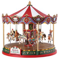 an old fashioned merry go round with horses on it's sides and the name grand carousel