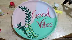 a paper plate with the words good vibes painted on it