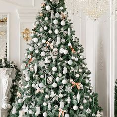 a decorated christmas tree in a white room