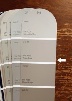 four different shades of paint on top of each other with arrows pointing to the same color