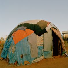 there is a tent that has been set up in the dirt