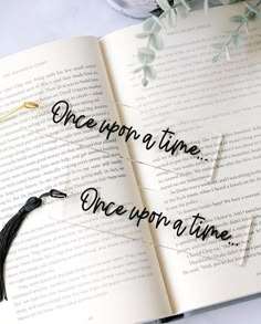 an open book with the words once upon a time on it