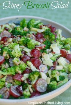 a salad with broccoli and grapes in a bowl