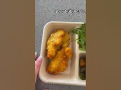 someone is holding a plastic container with food in it and the words about 600 cals