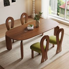 a wooden table with four green chairs in front of a white wall and large window