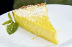 a slice of lemon pie on a white plate