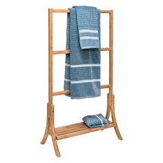 a wooden towel rack with two towels on it and one folded blue towel hanging from the top