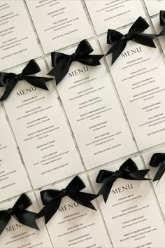 Wedding menu card printed on textured white card featuring a black satin bow detail Fancy Menu Ideas, Iron Gate Color Ideas Entrance, Black And White Wedding Name Cards, Black Tie Themed Wedding, Wedding Menu Table Setting, Black Tie Wedding Theme Classy, Black White Modern Wedding, White Black Wedding Decor, Black And White Menu Design