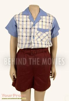 a male mannequin wearing a plaid shirt and maroon shorts