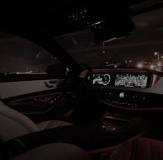 the interior of a modern car at night