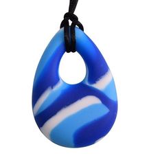 a blue and white striped pendant hangs from a black cord