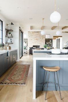 an image of a kitchen with blue cabinets and white counter tops on pinterest